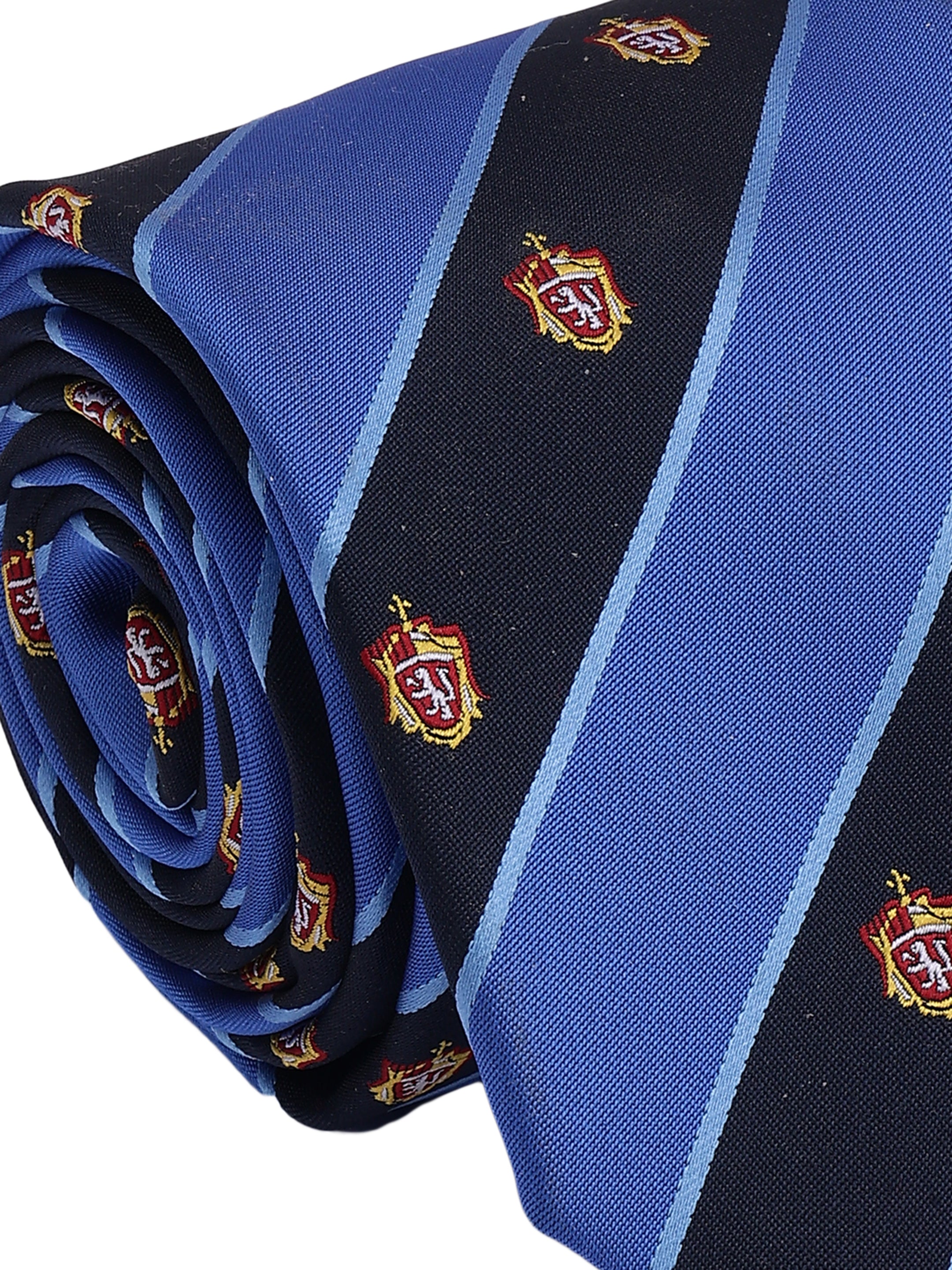 Folded blue and black tie with crest patterns on a white background